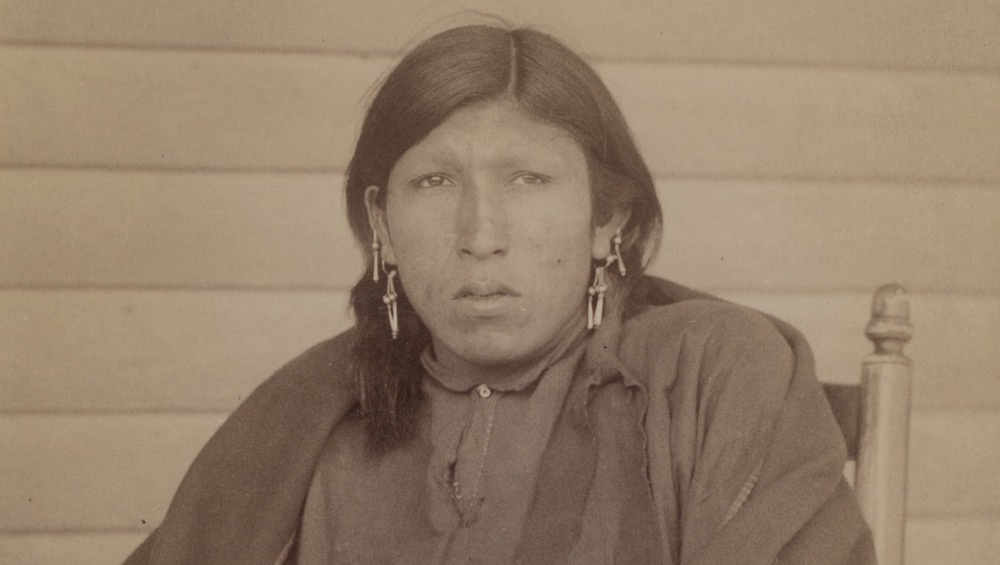Tasunka, Ota (alias Plenty Horse) sitting and frowning