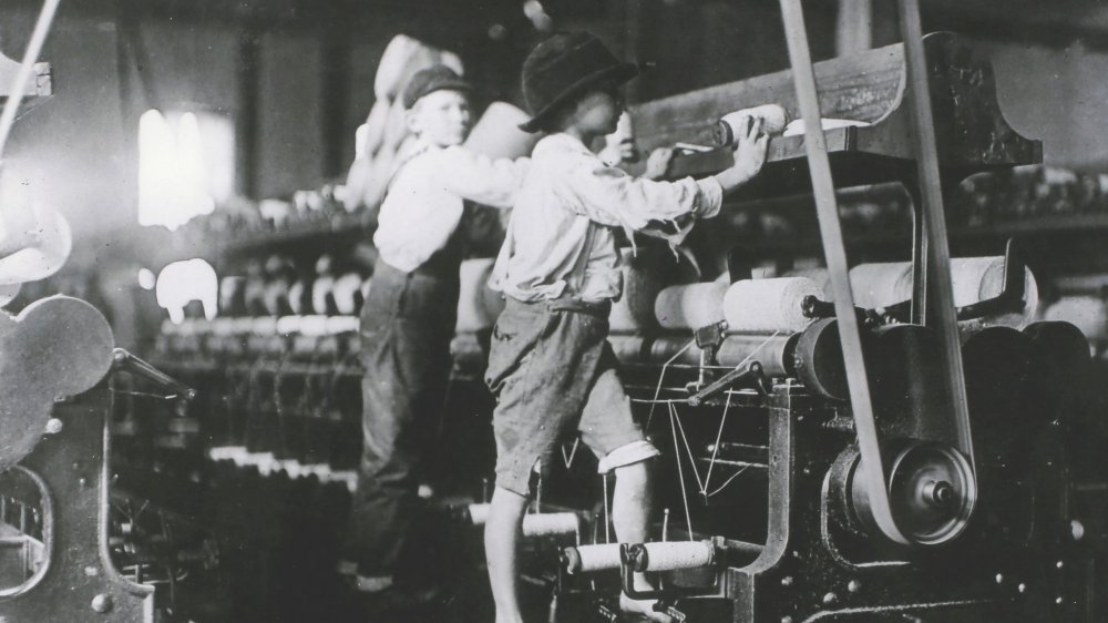 Boys workings textile machine