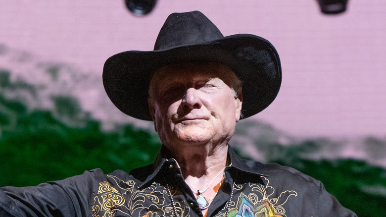 mike love smirking cowboy hat