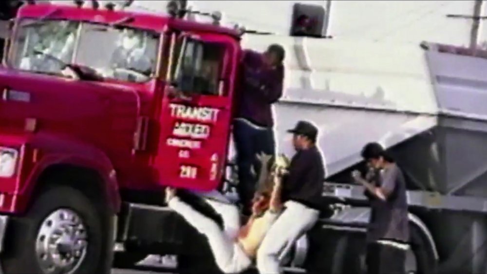 Young men pull Reginald Denny out of his trucker