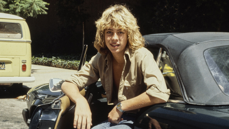 Leif Garrett posing in his sports car