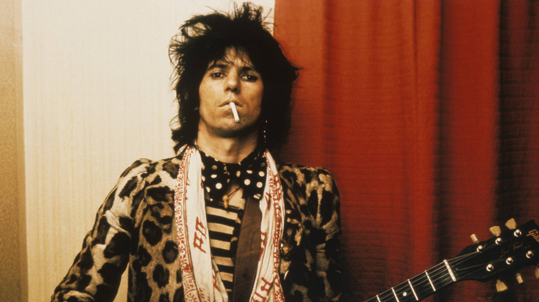 Keith Richards holding a guitar