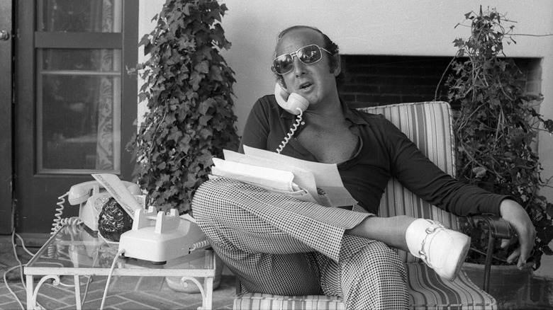 Columbia Records president Clive Davis speaking on the phone