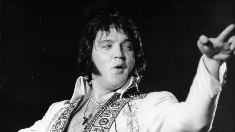 Elvis Presley performing onstage circa 1977