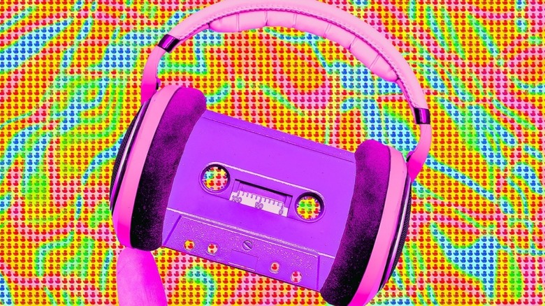 Purple cassette tape wearing pink headphones on colorful background