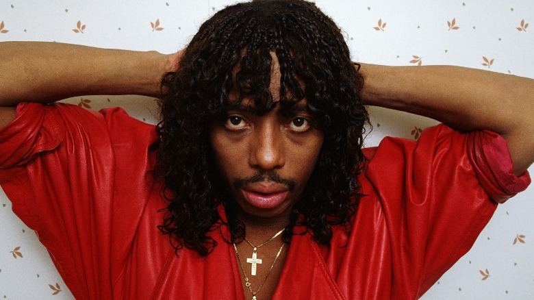 Rick James with hands on head