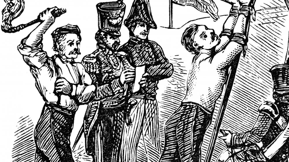 A soldier being lashed
