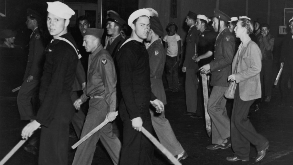 Gangs of American sailors and marines armed with sticks during the Zoot Suit Riots, Los Angeles, California, June 1943.