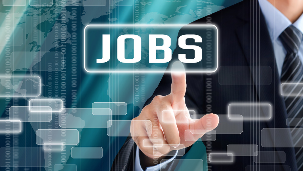 Male hand touching a "Jobs" icon on a virtual screen