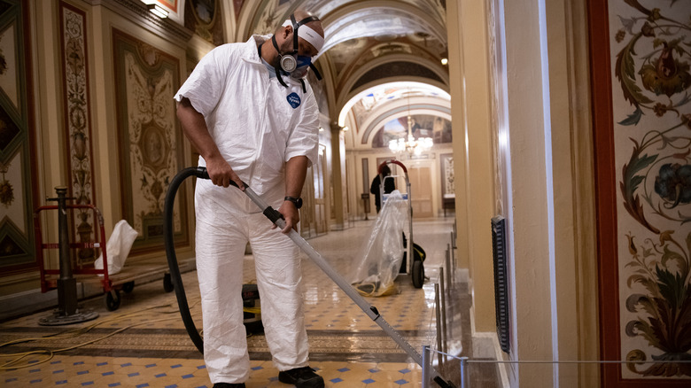 worker cleaning the Capitol