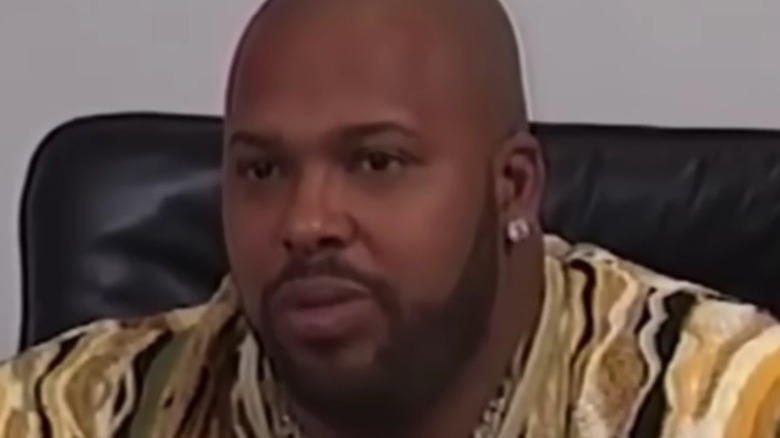 Suge Knight in black leather chair
