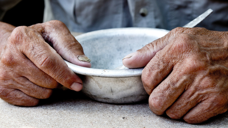 Hands with empty bowl