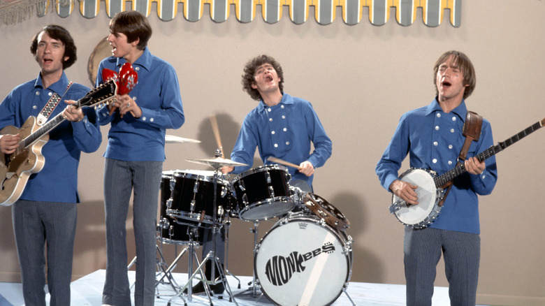 The Monkees playing on a stage