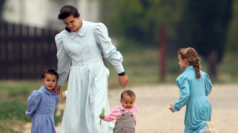 woman and children playing