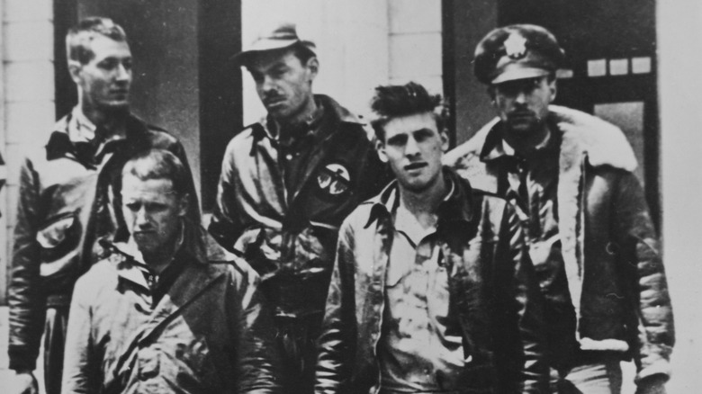 deshazer is at front left in this picture of captured raiders