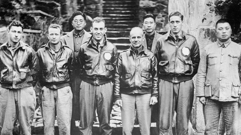 major doolittle and his crew pose with chinese friends