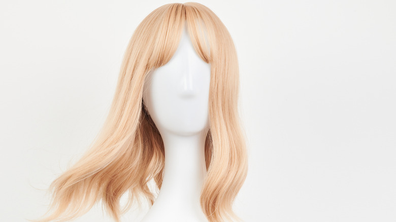 Blonde white on mannequin, white background