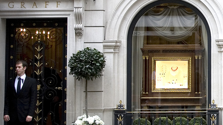 Exterior view of Graff Diamonds store in London with guard, days after 2009 robbery.