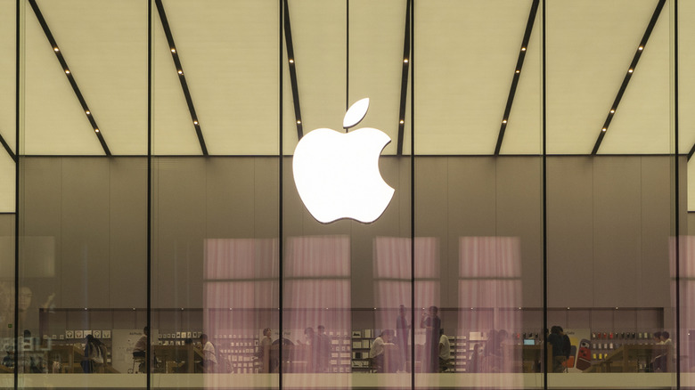 The Apple logo on a glass wall