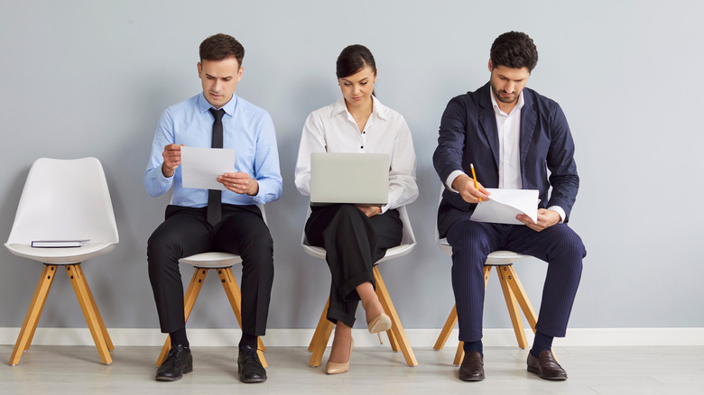 Job interview applicants seated in a row