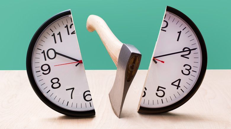 A clock cleaved with an axe
