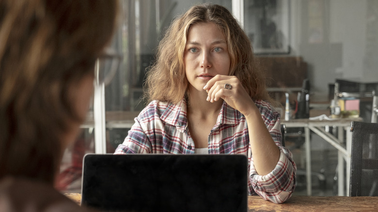 A woman shocked by a job interview question
