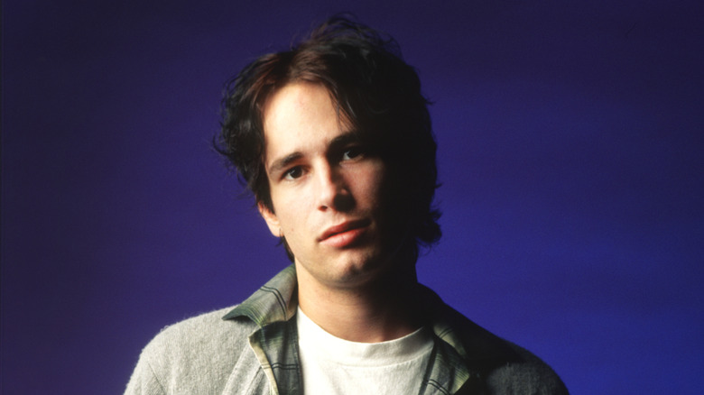 Jeff Buckley tilting head and looking into camera