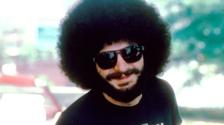 Sib Hashian smiling in sunglasses