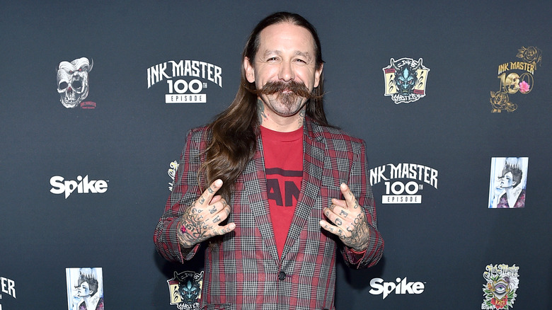 Oliver Peck posing at an event
