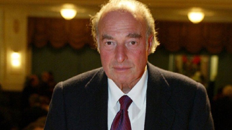 Marc Rich in suit looking at camera