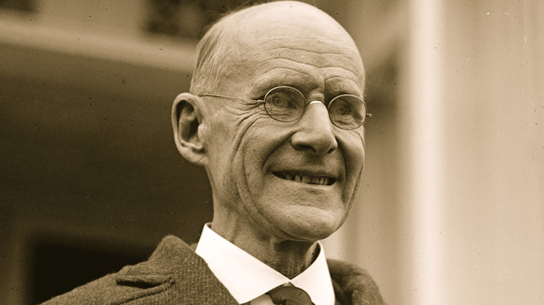 Eugene Debs grinning and looking out