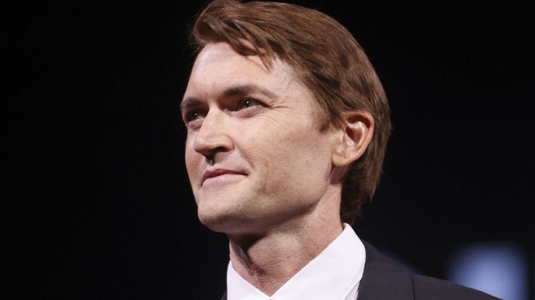 Ross Ulbricht smirking onstage