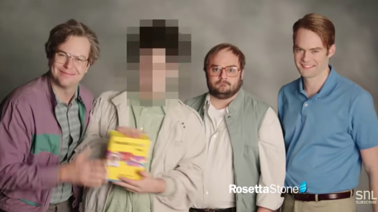 Four men one blurred face casual dress grey background