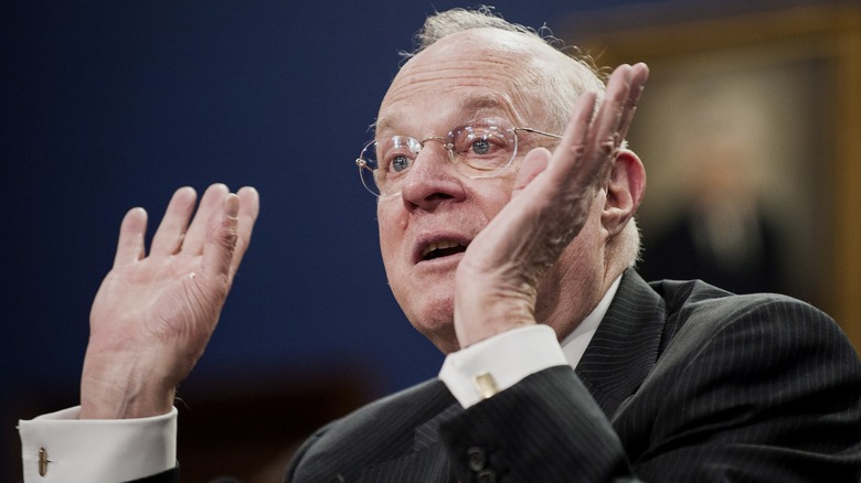 Justice Kennedy waving hands speaking