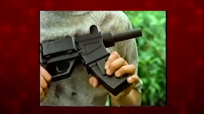 video screenshot of a realistic watergun with detachable clip