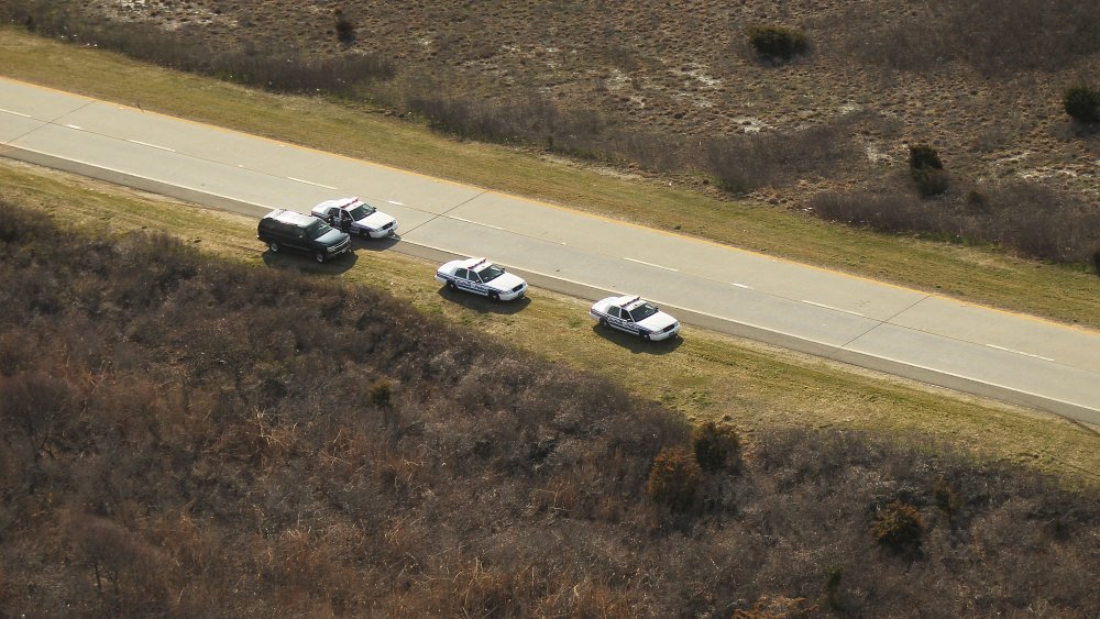 Police cars at Gilgo Beach