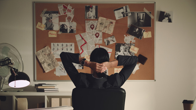 detective looking at a crime board