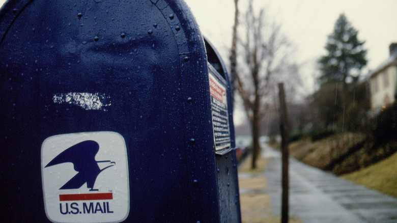 Mailbox reportedly used by Ames with white chalk mark on side.
