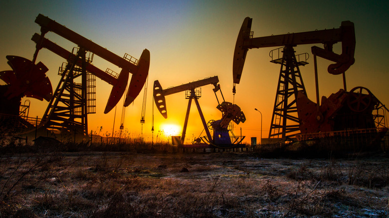 Drilling pumping unit in sunset