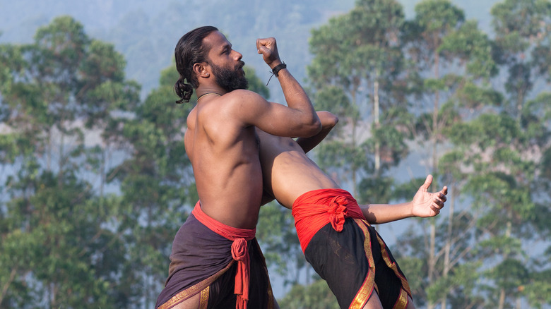 Kalaripayattu fighter holding opponent