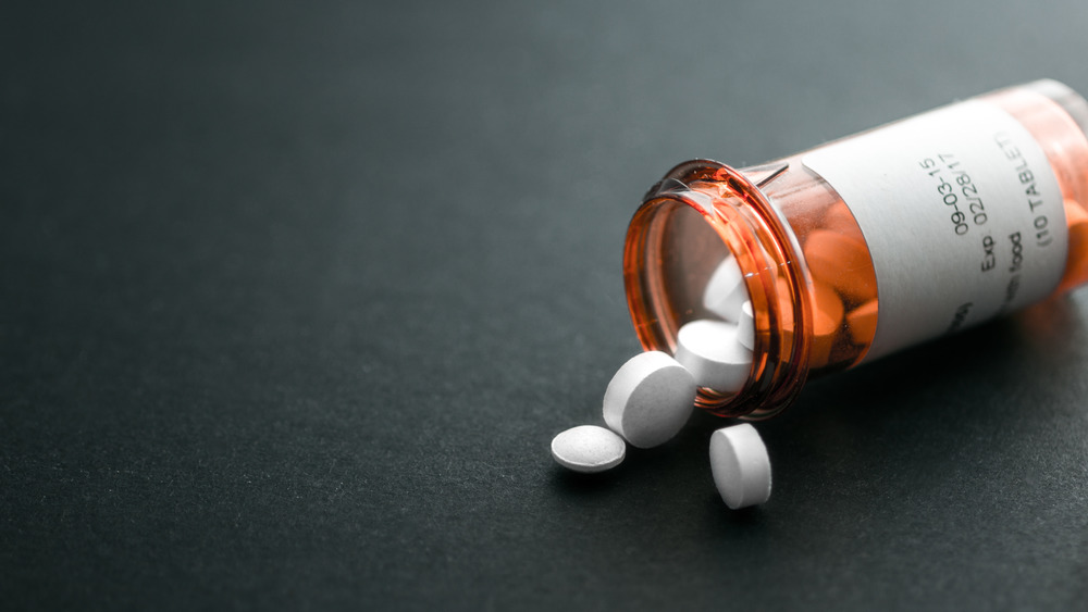 Pills spilling out of bottle