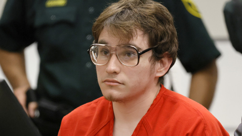 Nikolas Cruz in glasses and an orange jumpsuit at his sentencing