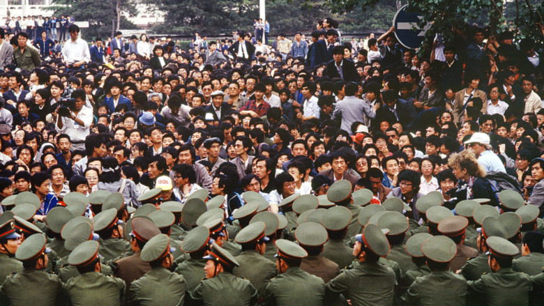 Students' protesters and soldiers stand off