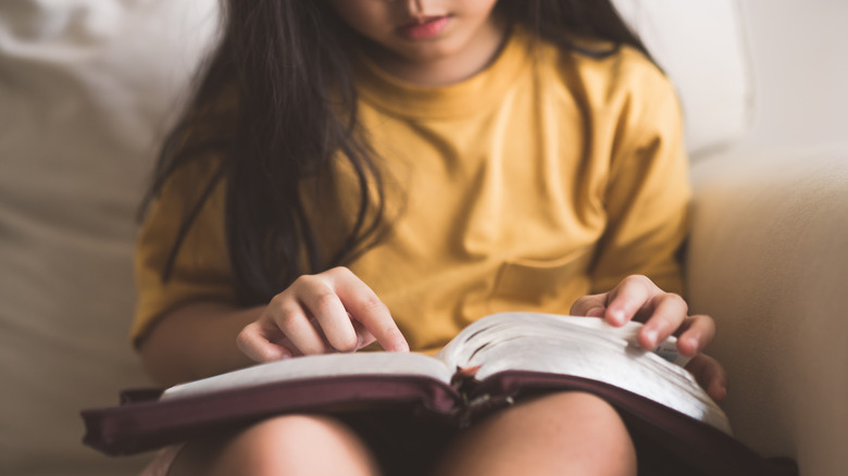 child reading bible