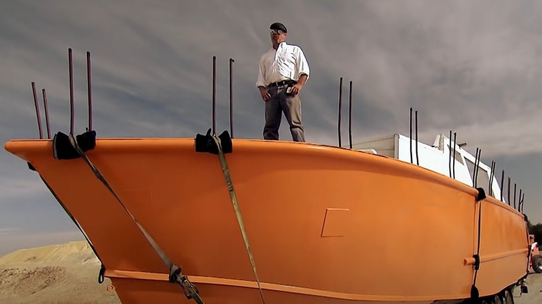 Jamie standing on boat