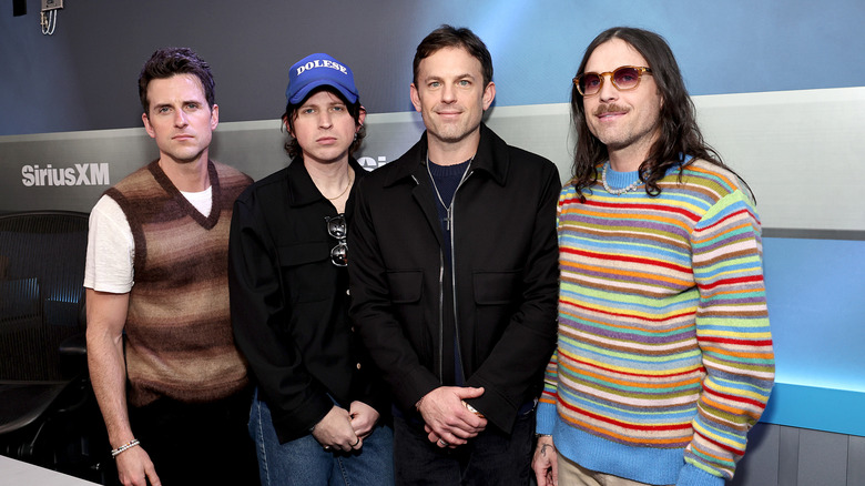 Caleb, Nathan, and Jared Followill of Kings of Leon with their cousin Matthew at an event