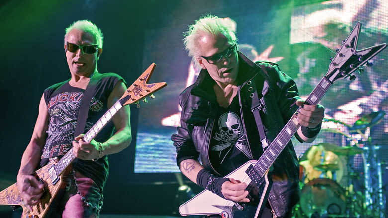 Michael and Rudolf Schenker of Scorpions playing flying-V guitars onstage