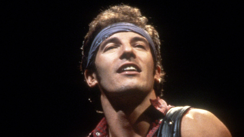 Bruce Springsteen looking up onstage in the 1980s