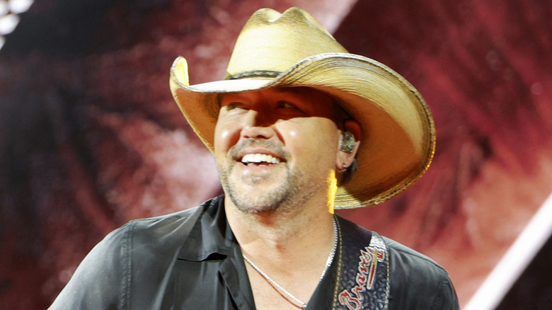 Jason Aldean smiling onstage