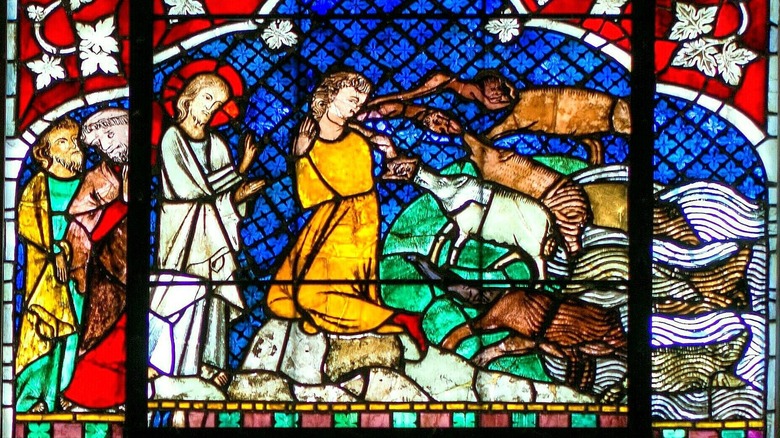 Stained glass Jesus casting out demons